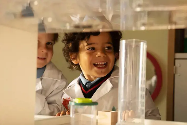 A young St George's School pupil in science class